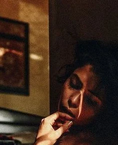 Moody portrait crop of an adult woman in warm evening light