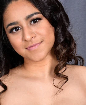 Smiling adult woman in a softly lit portrait